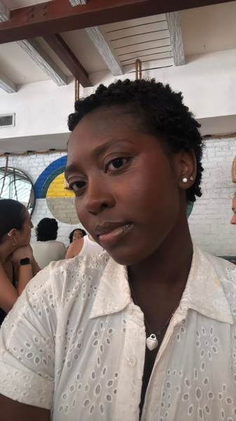 Black woman with coily pixie haircut