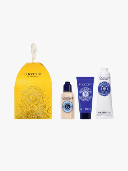 L’Occitane Shea Holiday Ornament Gift Set in branded components on a light gray background