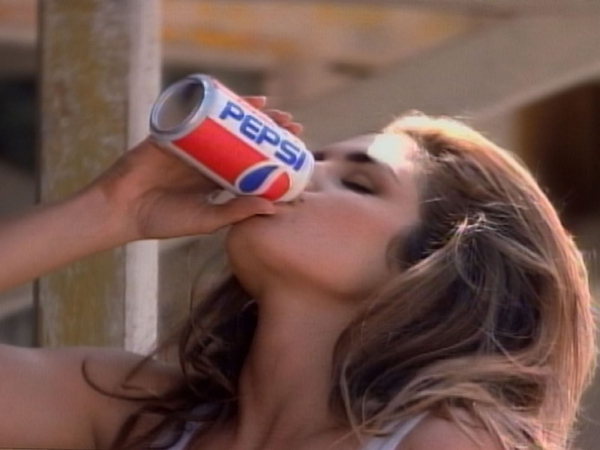 Supermodel Cindy Crawford drinks a Pepsi in an awardwinning ad produced for regular Pepsi in 1991
